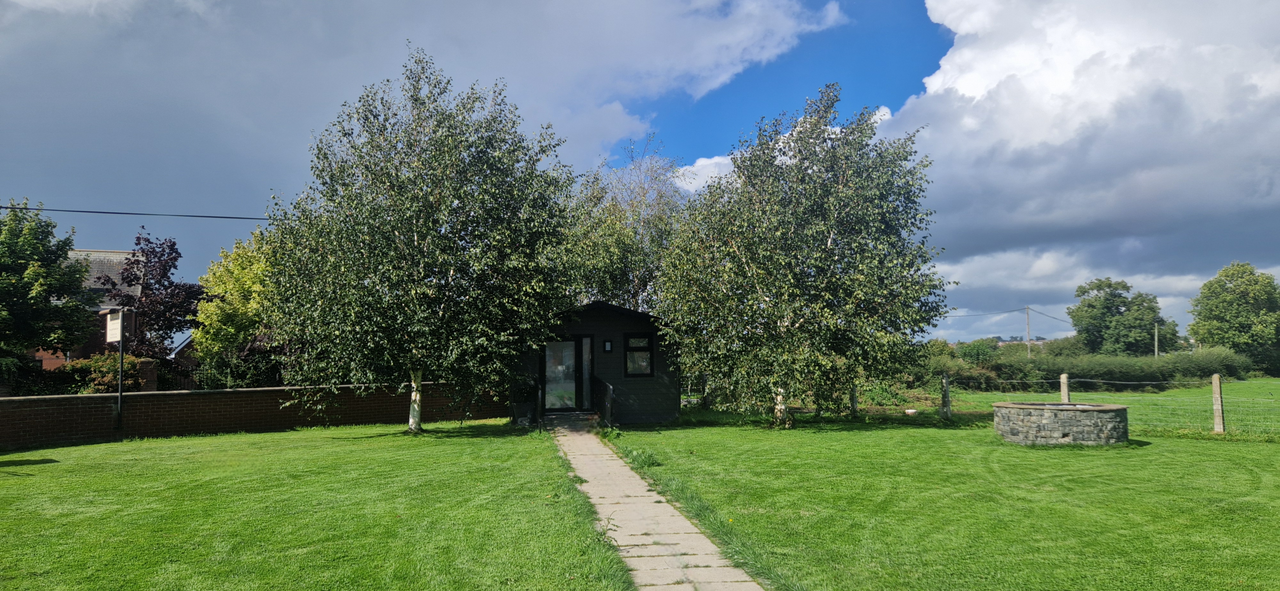 Exterior of the farewell room log cabin
